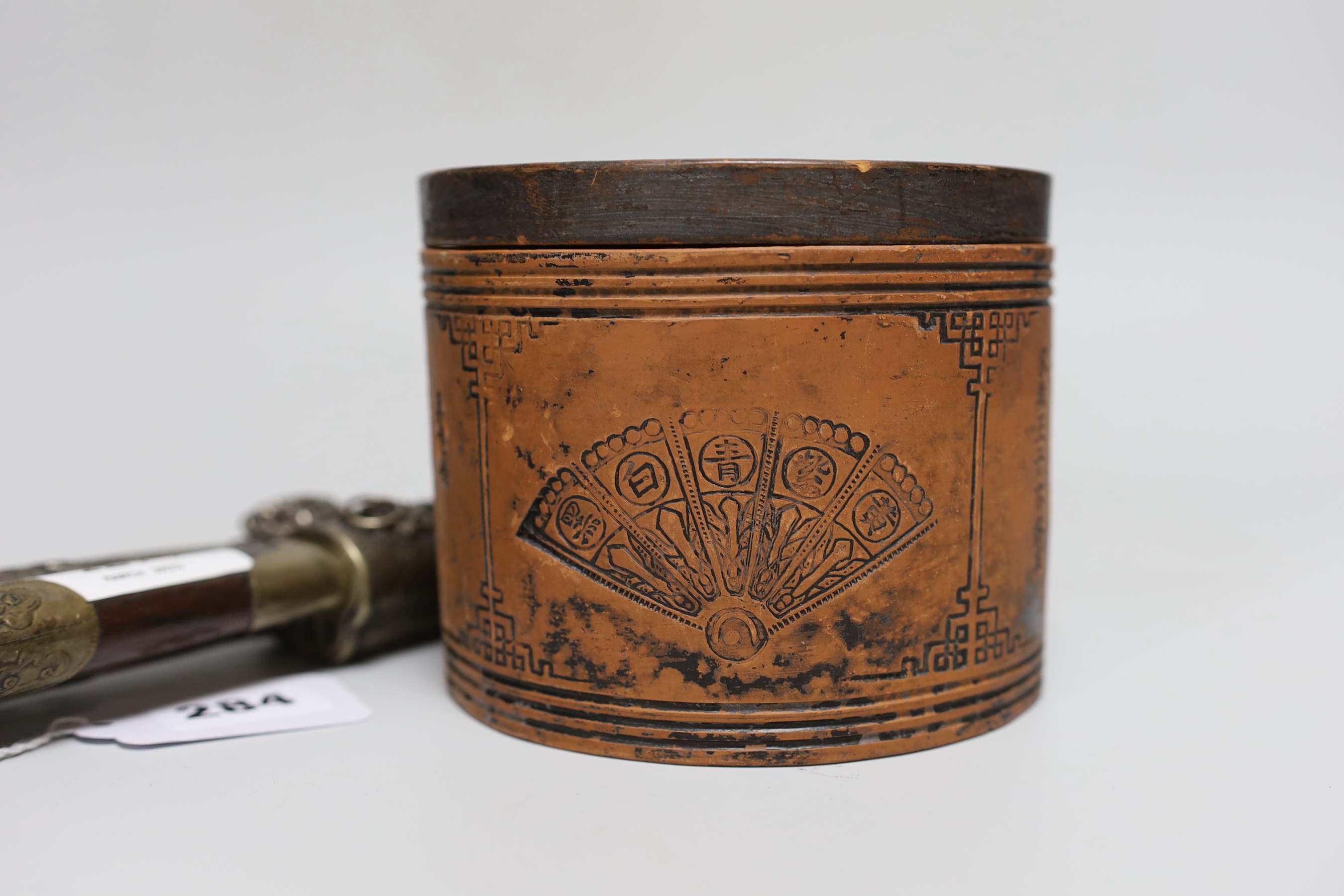 Two Chinese knives and a terracotta lidded pot